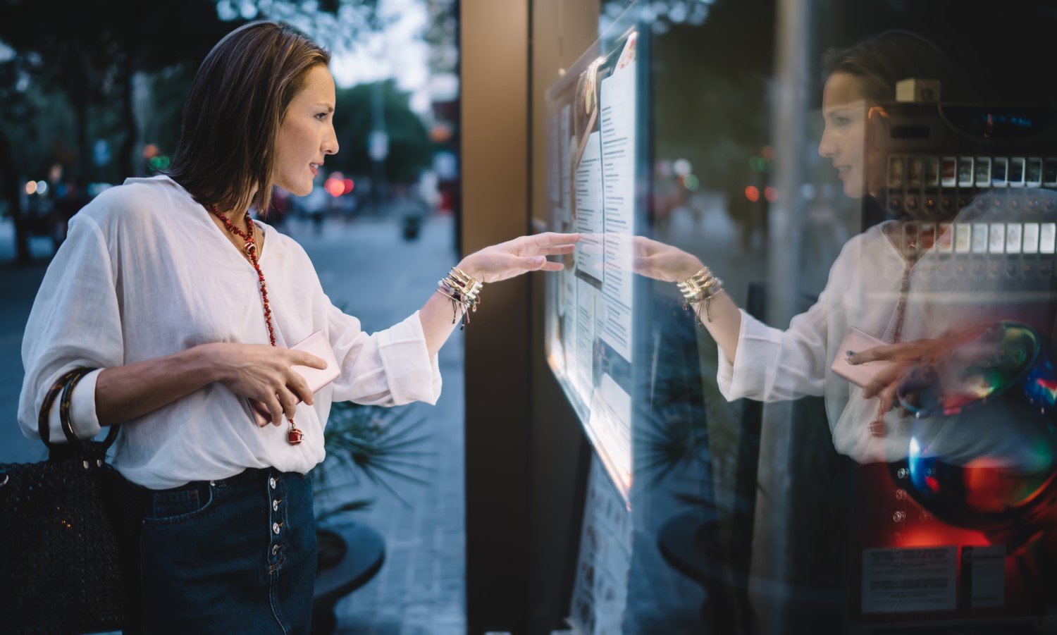 A Young Girl is Choosing the Right Digital Signage for Business