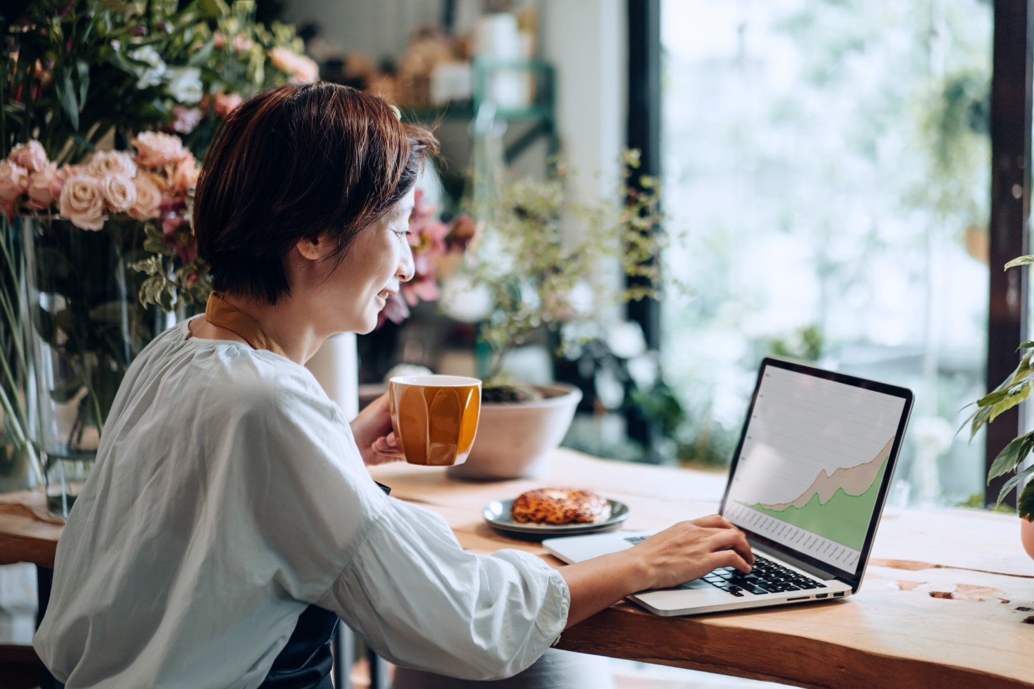 A Women Checking the Shopify Analytics