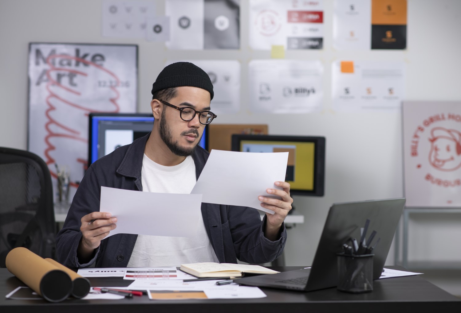 A Man is Checking the Common Logo Design Mistakes