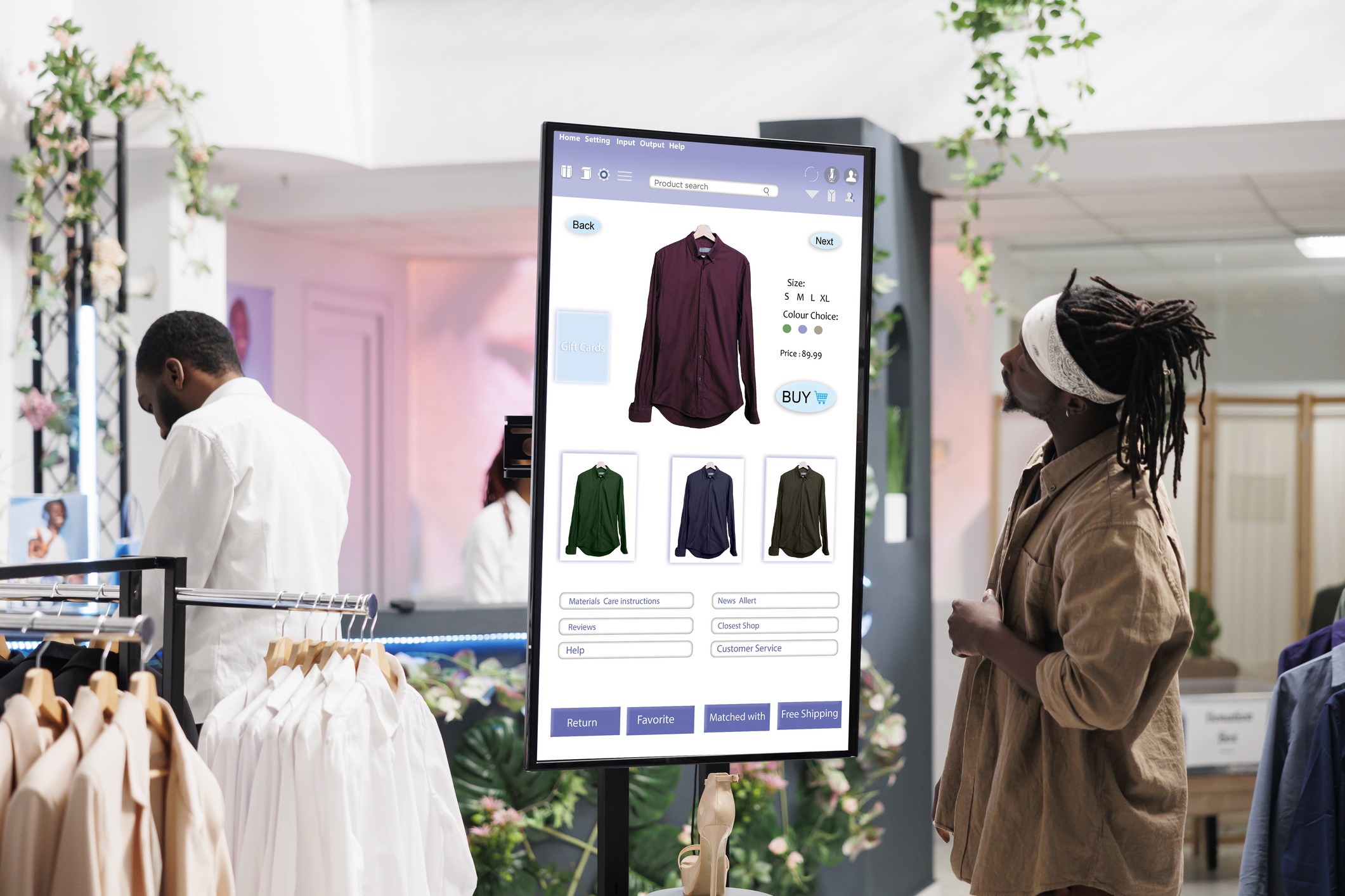 A man viewing cloud based digital signage displays inside a modern shopping store