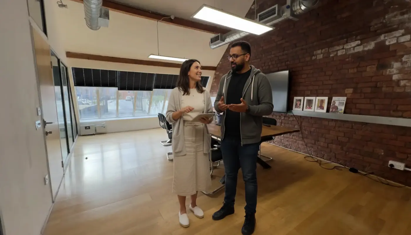 Jessica and Omar discussing TikTok content setup inside a UK creator studio.