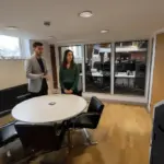 Adam and Sara discussing long tail ecommerce strategy inside a UK office environment.