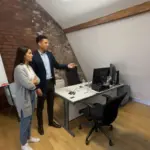 Zak and Sara discussing CRM strategy inside a UK office environment.