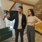 Zak and Sara discussing filming setup inside a UK creator studio.