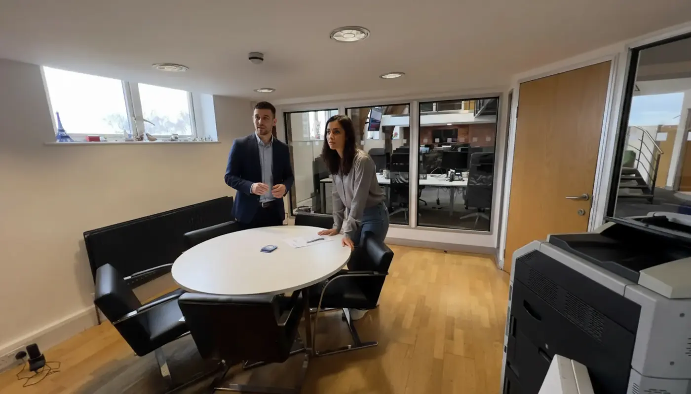 Adam and Sara discussing content strategy inside a UK office.