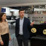 Adam and Jessica discussing ecommerce SEO inside a UK office environment.