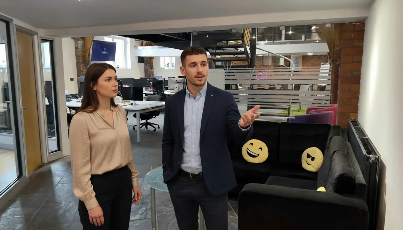 Adam and Jessica discussing ecommerce SEO inside a UK office environment.