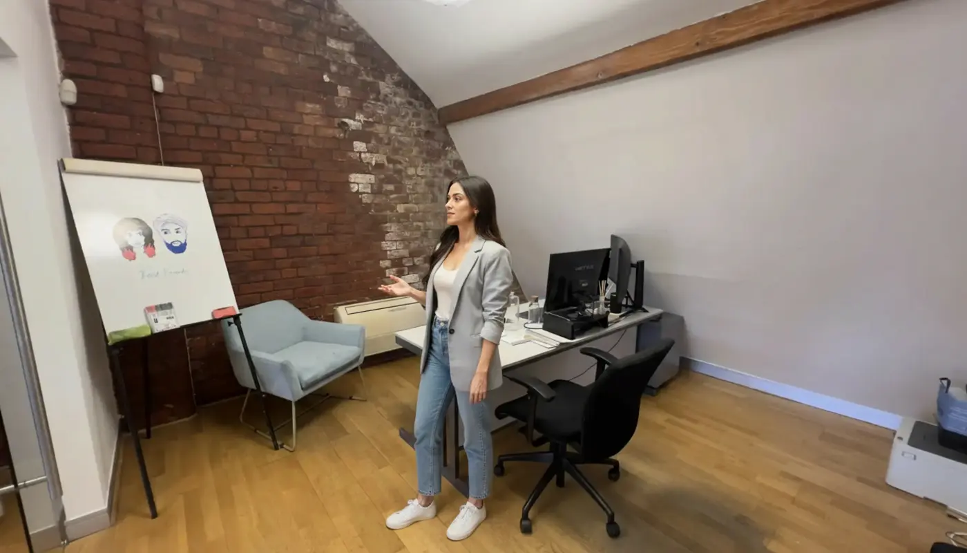 Zak and Sara collaborating inside a UK office, mid-discussion about WordPress SEO.