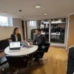 Jessica and Adam discussing SEO keyword strategy inside a UK office.