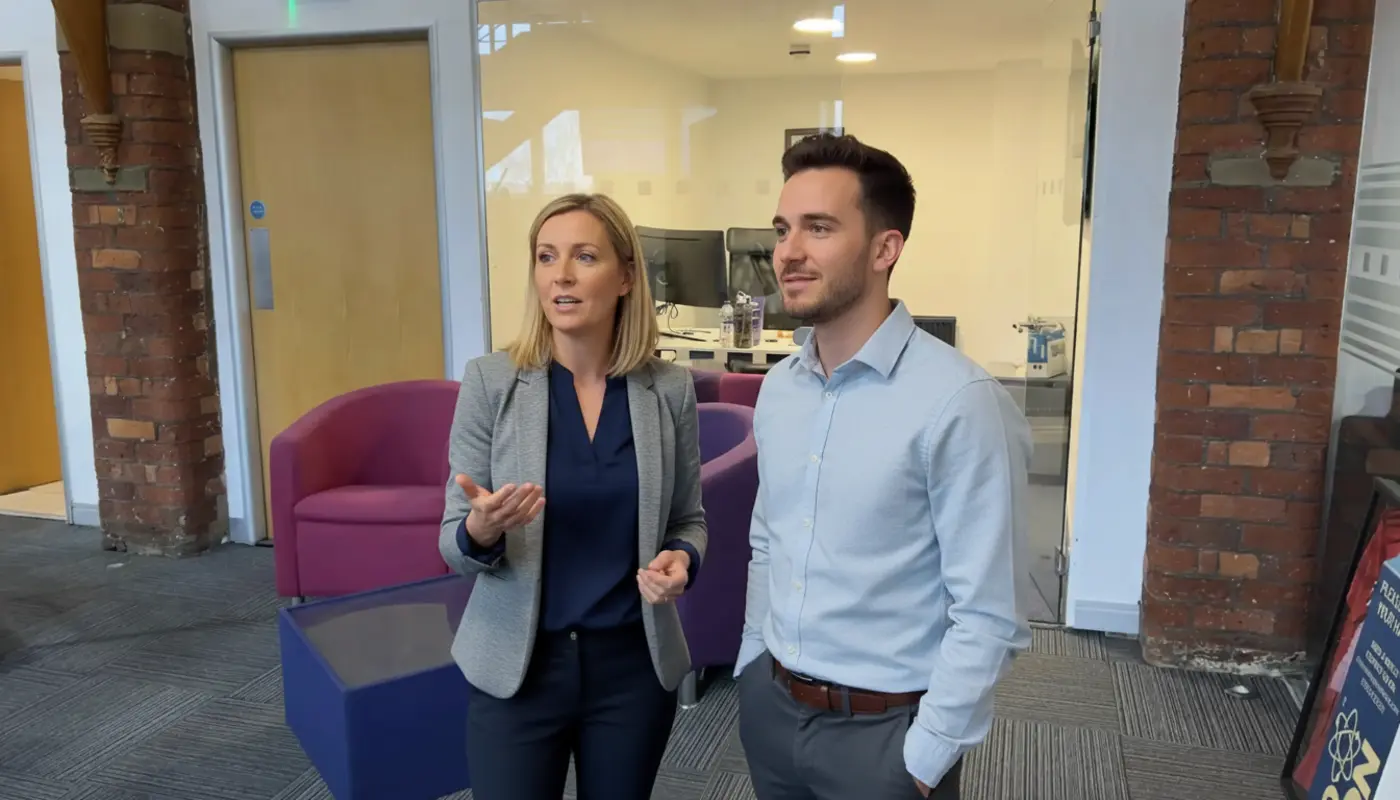 Jessica and Adam discussing IT support options inside a UK office.