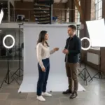 Sara and Adam discussing TikTok Shop access inside a UK creator studio.
