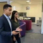 Zak and Sara discussing website planning inside a UK office.